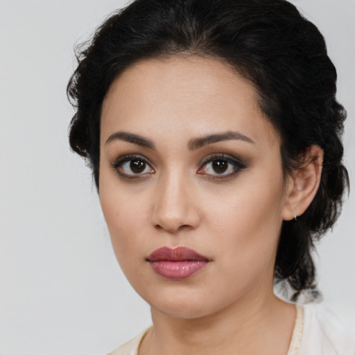 Neutral latino young-adult female with long  brown hair and brown eyes