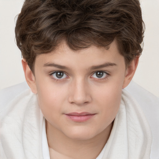 Joyful white child male with short  brown hair and brown eyes