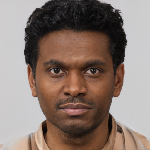 Neutral black young-adult male with short  black hair and brown eyes