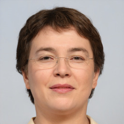 Joyful white adult female with short  brown hair and brown eyes