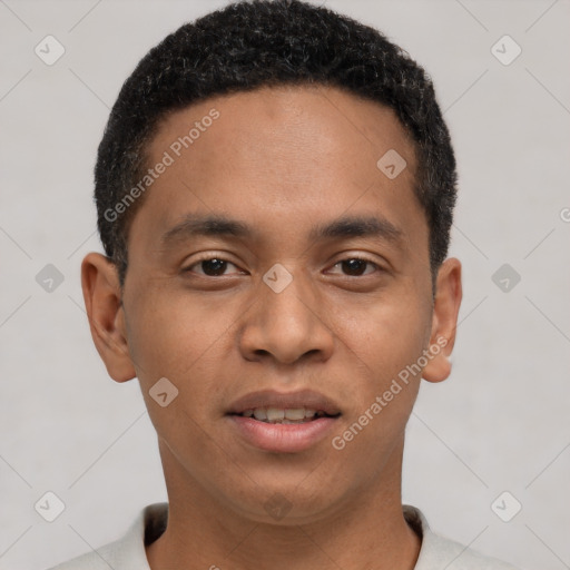 Joyful latino young-adult male with short  black hair and brown eyes