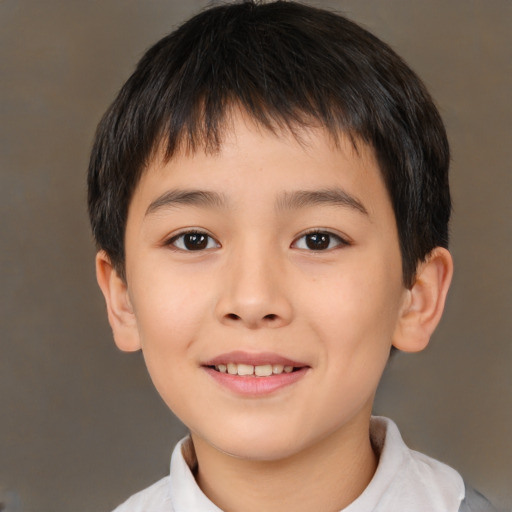 Joyful white child male with short  brown hair and brown eyes