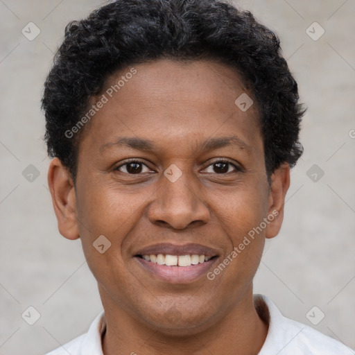 Joyful latino young-adult male with short  brown hair and brown eyes