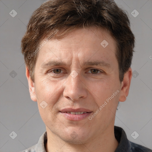 Joyful white adult male with short  brown hair and grey eyes