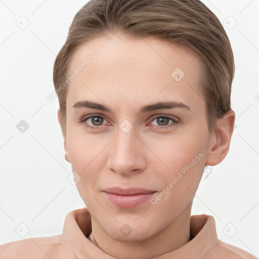 Joyful white young-adult female with short  brown hair and grey eyes