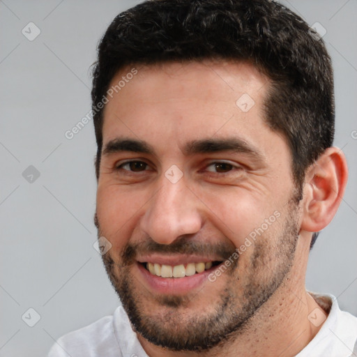 Joyful white adult male with short  brown hair and brown eyes