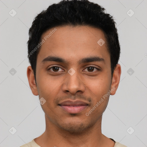 Joyful latino young-adult male with short  black hair and brown eyes