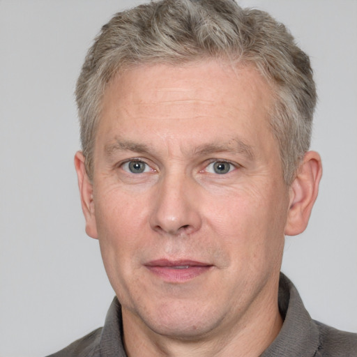 Neutral white middle-aged male with short  brown hair and grey eyes