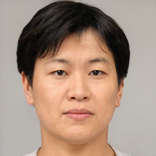 Neutral asian young-adult male with short  brown hair and brown eyes