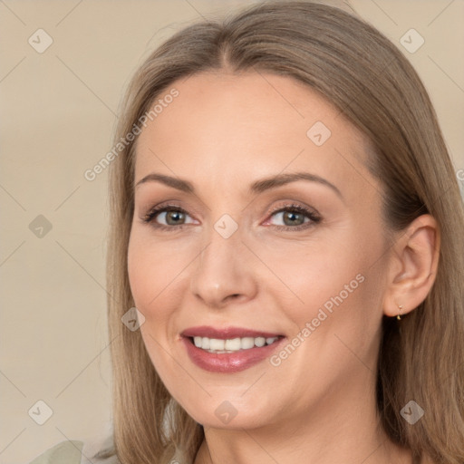 Joyful white adult female with long  brown hair and brown eyes