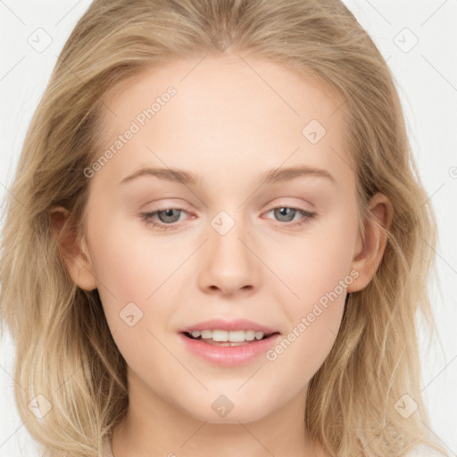 Joyful white young-adult female with long  brown hair and blue eyes