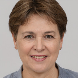 Joyful white adult female with short  brown hair and brown eyes