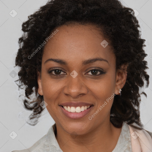 Joyful black young-adult female with medium  brown hair and brown eyes