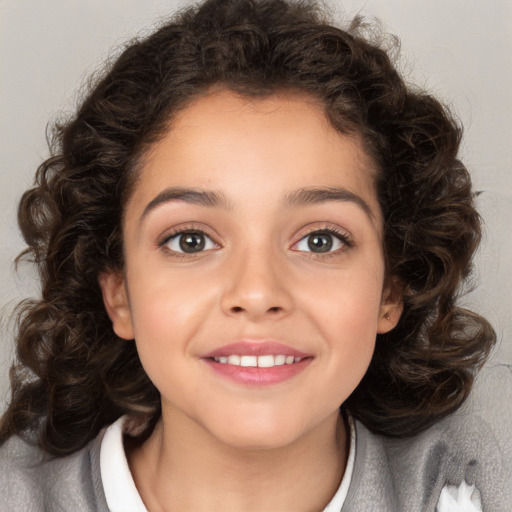 Joyful white child female with medium  brown hair and brown eyes