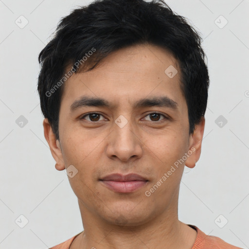 Joyful asian young-adult male with short  black hair and brown eyes