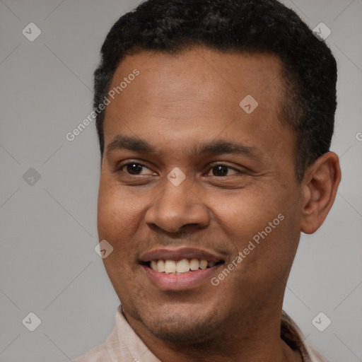 Joyful latino young-adult male with short  brown hair and brown eyes