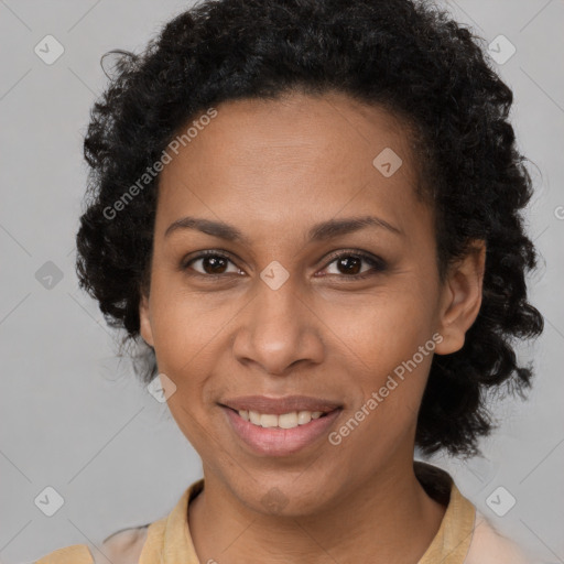 Joyful black adult female with short  brown hair and brown eyes