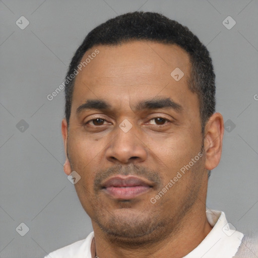 Neutral latino adult male with short  black hair and brown eyes