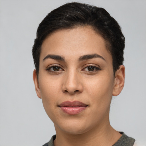 Joyful latino young-adult female with short  brown hair and brown eyes