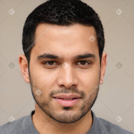 Joyful white young-adult male with short  black hair and brown eyes