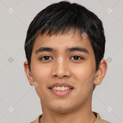 Joyful asian young-adult male with short  brown hair and brown eyes