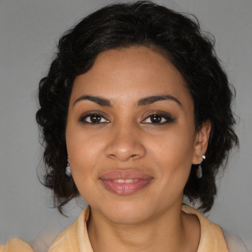 Joyful black young-adult female with medium  brown hair and brown eyes