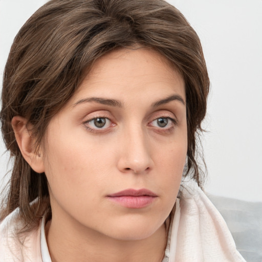 Neutral white young-adult female with medium  brown hair and grey eyes