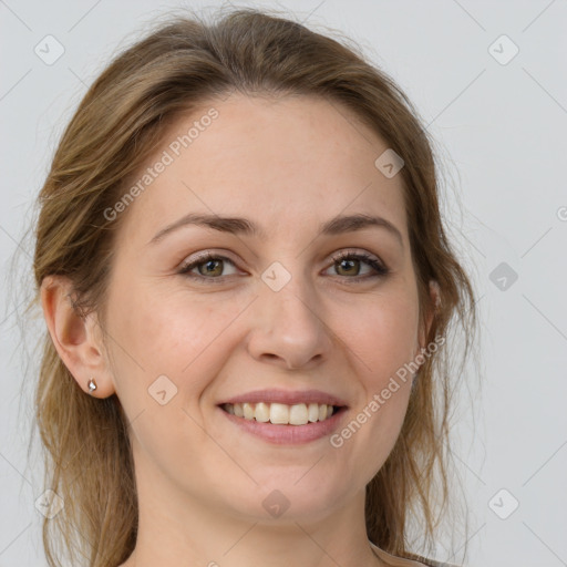 Joyful white young-adult female with medium  brown hair and green eyes