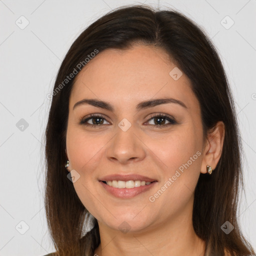 Joyful white young-adult female with long  brown hair and brown eyes