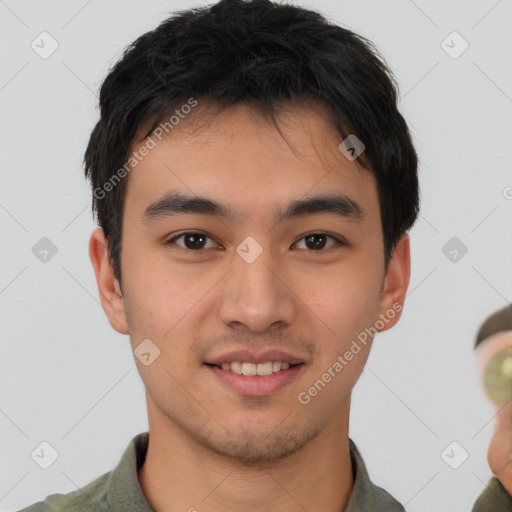 Joyful asian young-adult male with short  brown hair and brown eyes