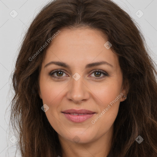 Joyful white adult female with long  brown hair and brown eyes