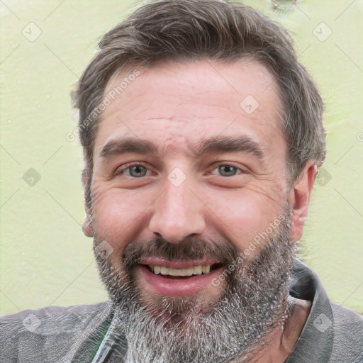 Joyful white adult male with short  brown hair and grey eyes