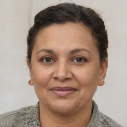 Joyful white adult female with short  brown hair and brown eyes