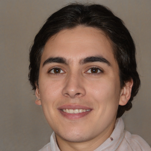 Joyful white young-adult male with medium  brown hair and brown eyes