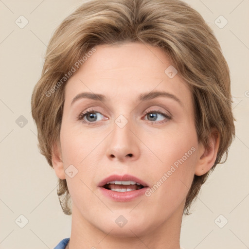 Joyful white young-adult female with medium  brown hair and green eyes