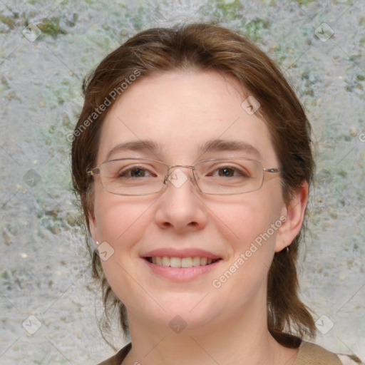 Joyful white adult female with medium  brown hair and blue eyes