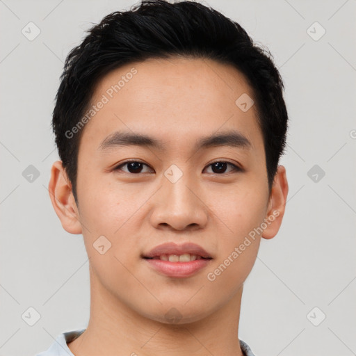 Joyful asian young-adult male with short  black hair and brown eyes