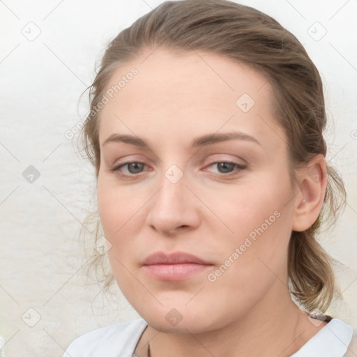 Joyful white young-adult female with medium  brown hair and blue eyes