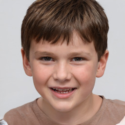 Joyful white child male with short  brown hair and brown eyes