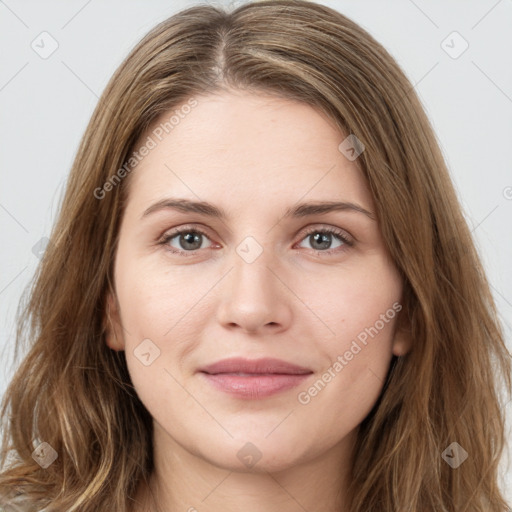 Joyful white young-adult female with long  brown hair and green eyes