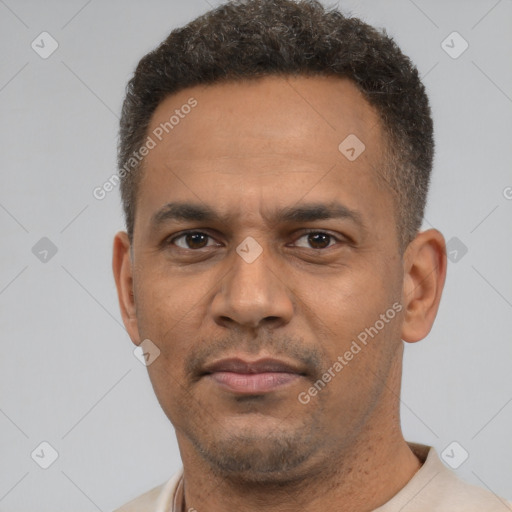 Neutral latino adult male with short  brown hair and brown eyes