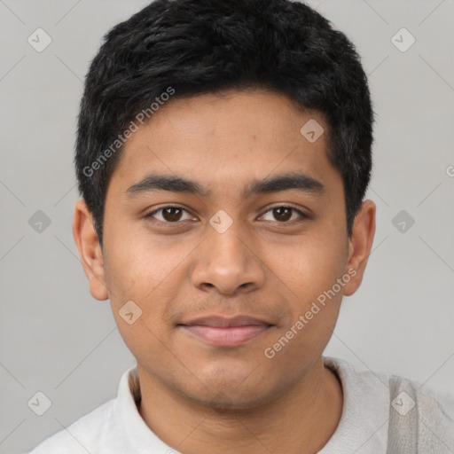 Joyful latino young-adult male with short  black hair and brown eyes