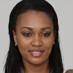 Joyful black young-adult female with long  black hair and brown eyes
