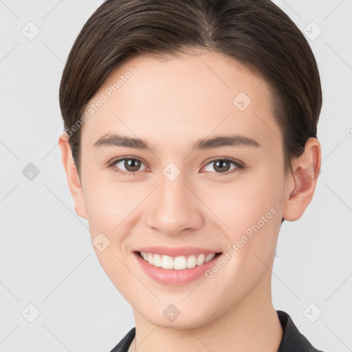 Joyful white young-adult female with short  brown hair and brown eyes