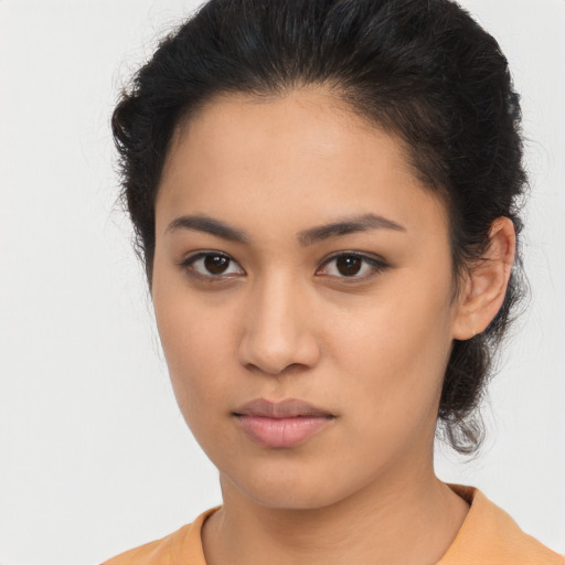 Neutral latino young-adult female with medium  brown hair and brown eyes
