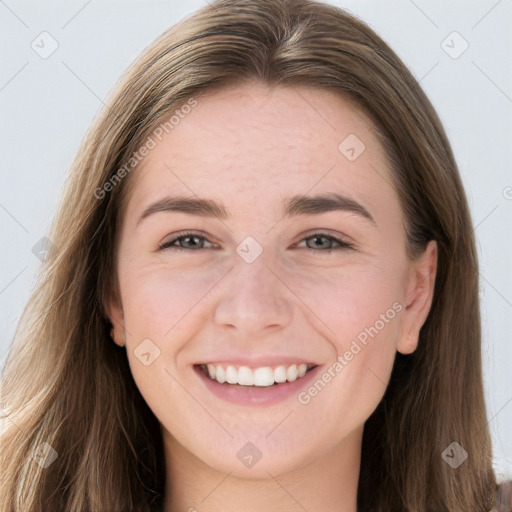 Joyful white young-adult female with long  brown hair and grey eyes