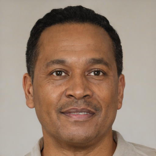 Neutral latino adult male with short  brown hair and brown eyes