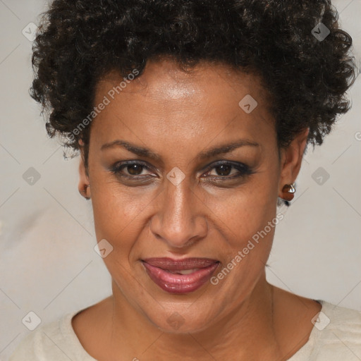 Joyful black adult female with short  brown hair and brown eyes