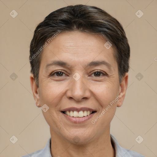 Joyful white adult female with short  brown hair and brown eyes