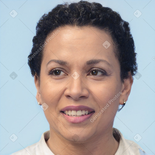 Joyful black adult female with short  brown hair and brown eyes